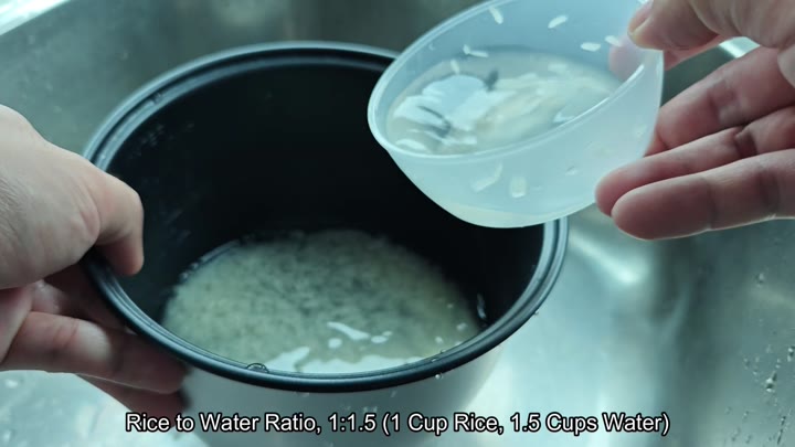 Adding water to rice in the pot Adding water to rice in the pot