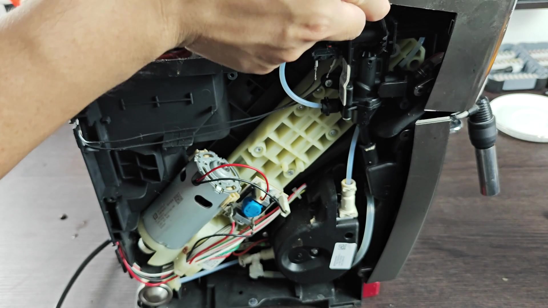 Adjusting internal tube near bean hopper Adjusting internal tube near bean hopper
