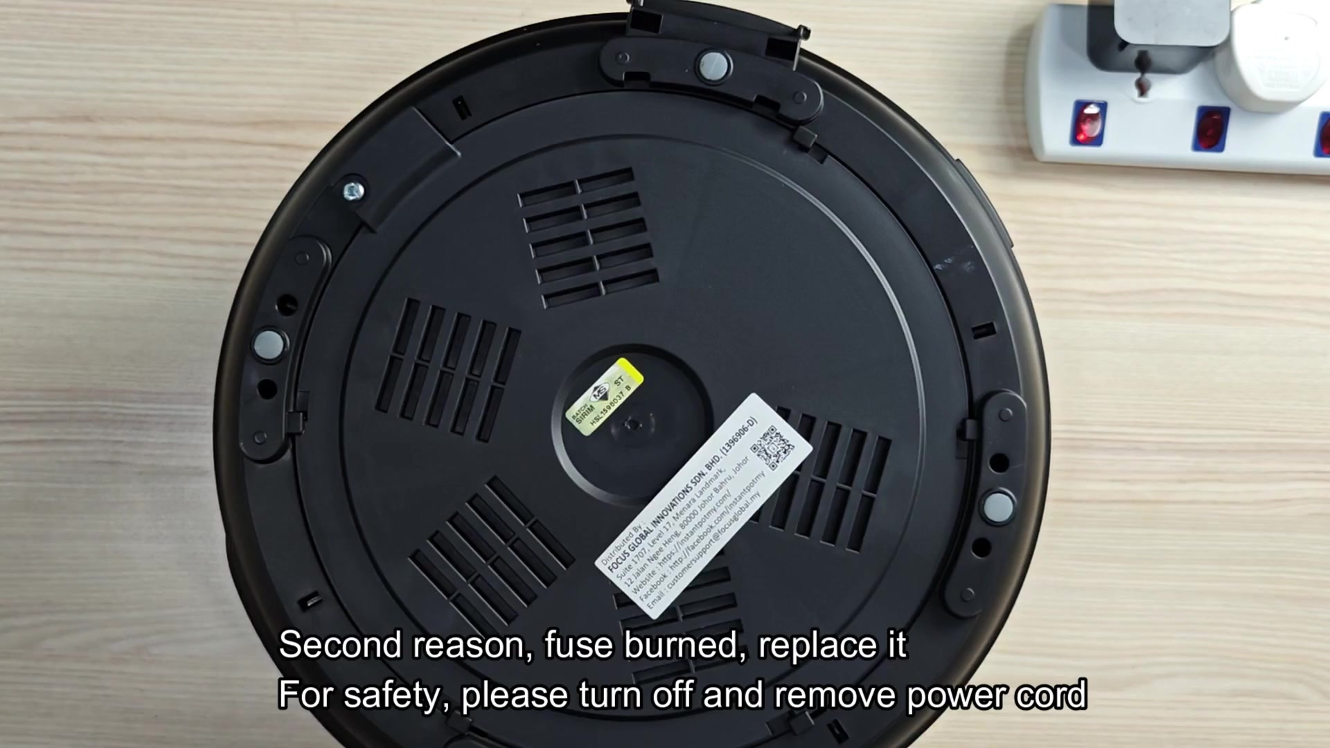 Appliance bottom with safety warning text Appliance bottom with safety warning text