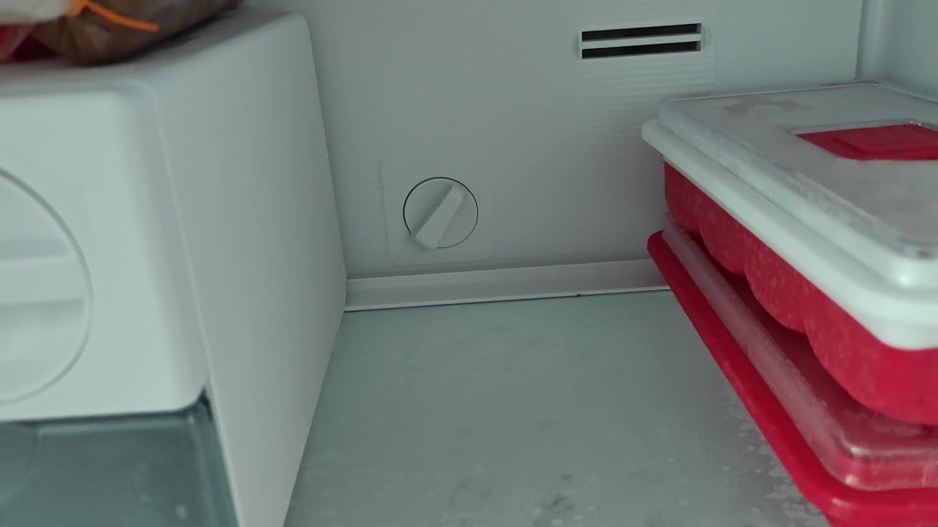 Checking coldness of plastic freezer unit Checking coldness of plastic freezer unit