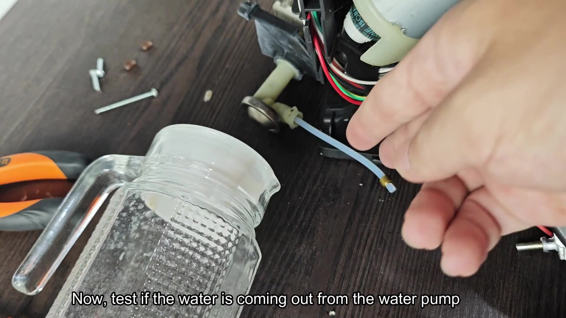 Checking water output from pump tube Checking water output from pump tube