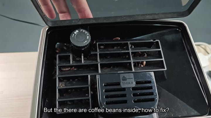 Coffee beans visible in grinder hopper Coffee beans visible in grinder hopper