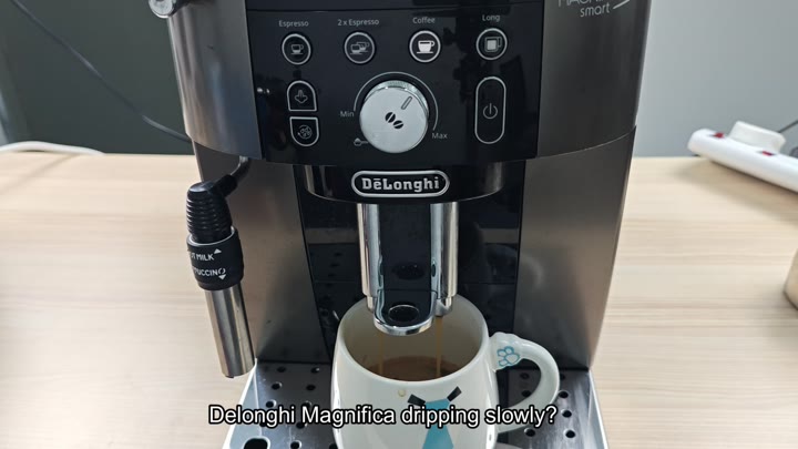 Coffee dripping slowly into mug Coffee dripping slowly into mug