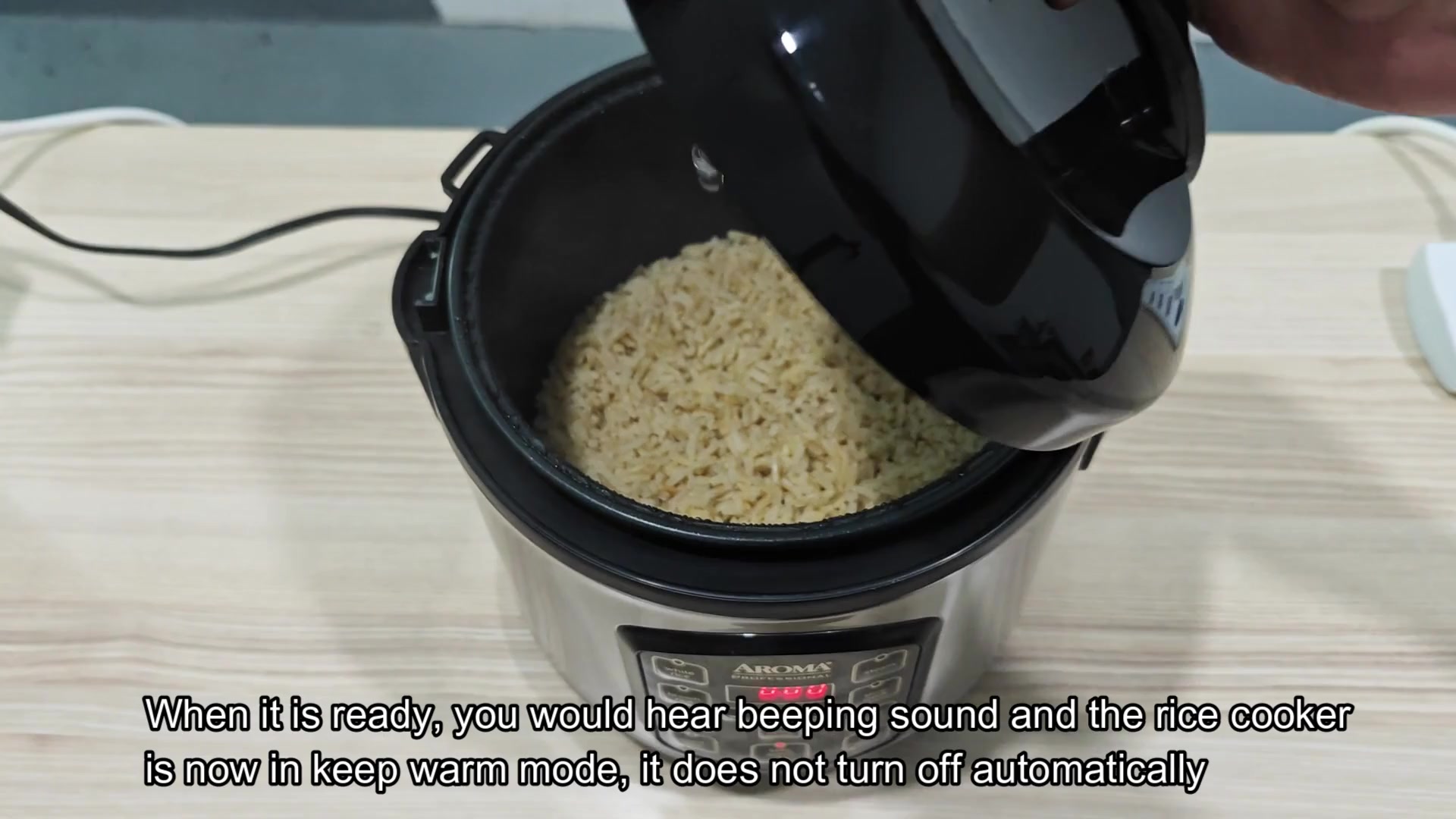 Cooked brown rice inside open pot Cooked brown rice inside open pot