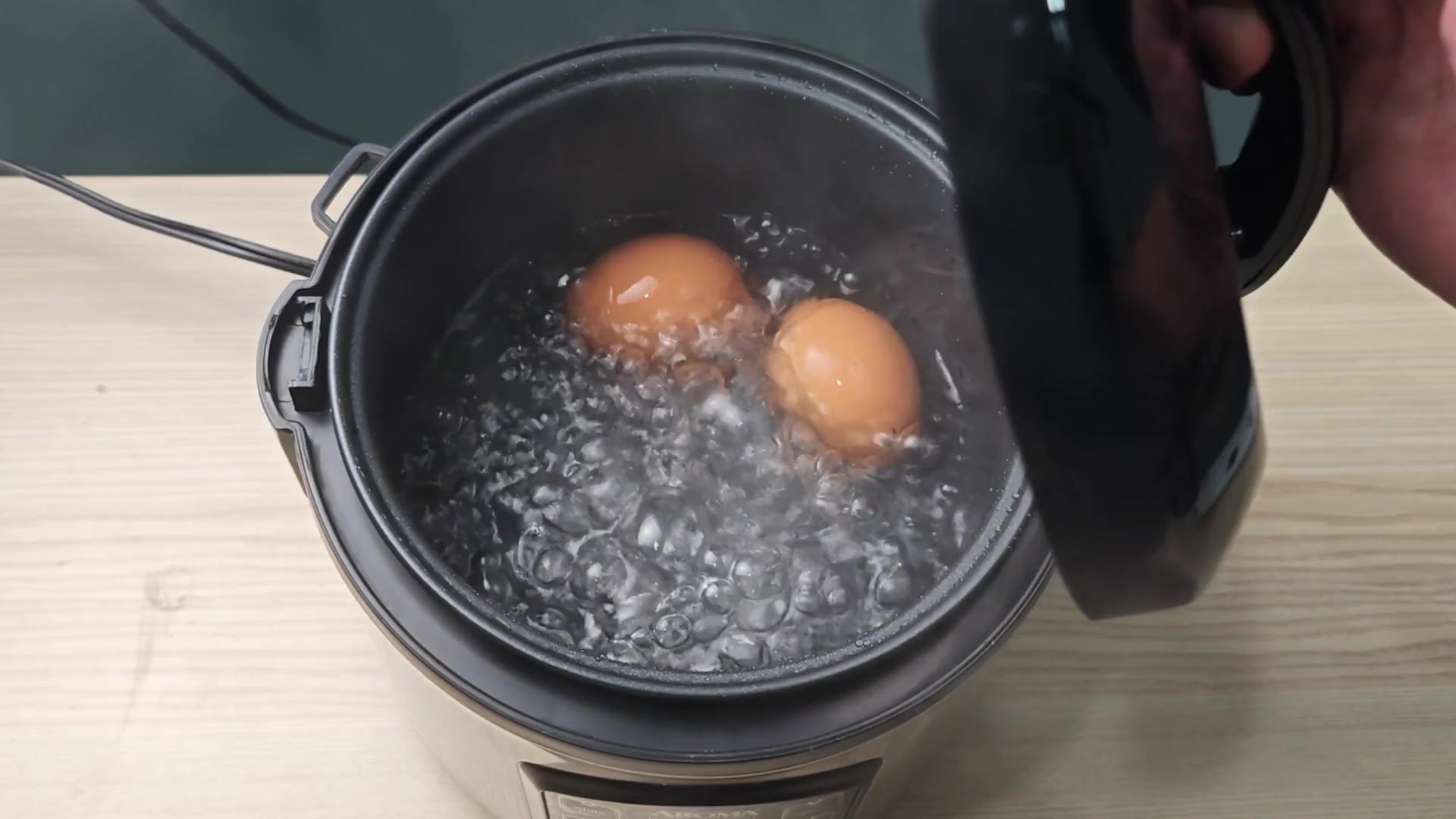 Eggs boiling vigorously inside pot Eggs boiling vigorously inside pot