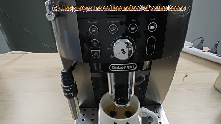 Espresso dispensing into white mug Espresso dispensing into white mug