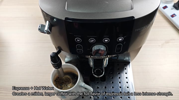 Espresso machine dispensing into white mug Espresso machine dispensing into white mug