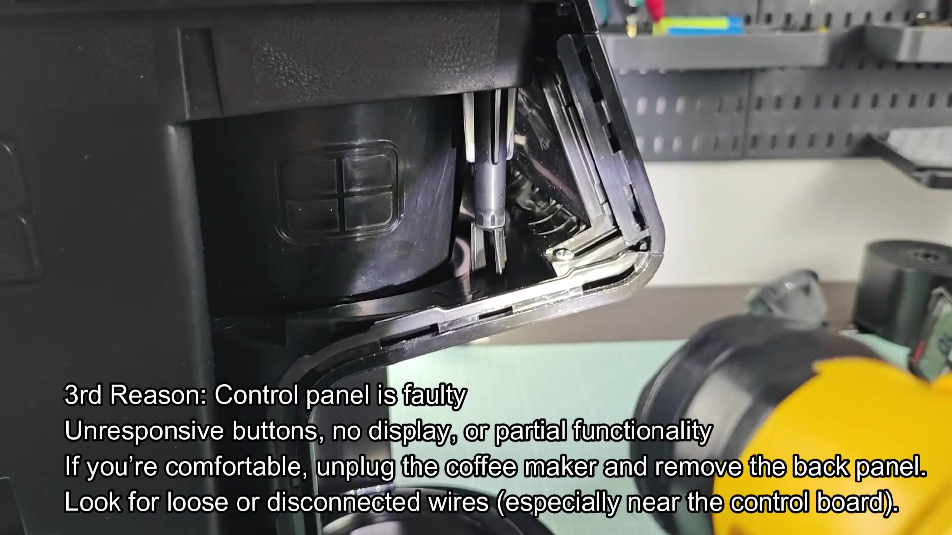 Flashlight illuminating internal coffee maker wiring Flashlight illuminating internal coffee maker wiring