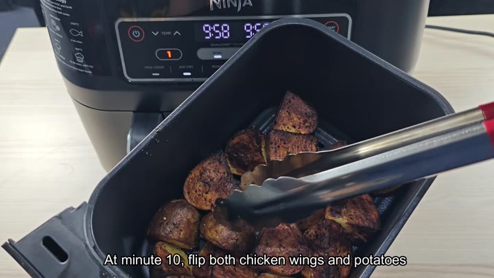 Flipping roasted potato chunks with tongs Flipping roasted potato chunks with tongs