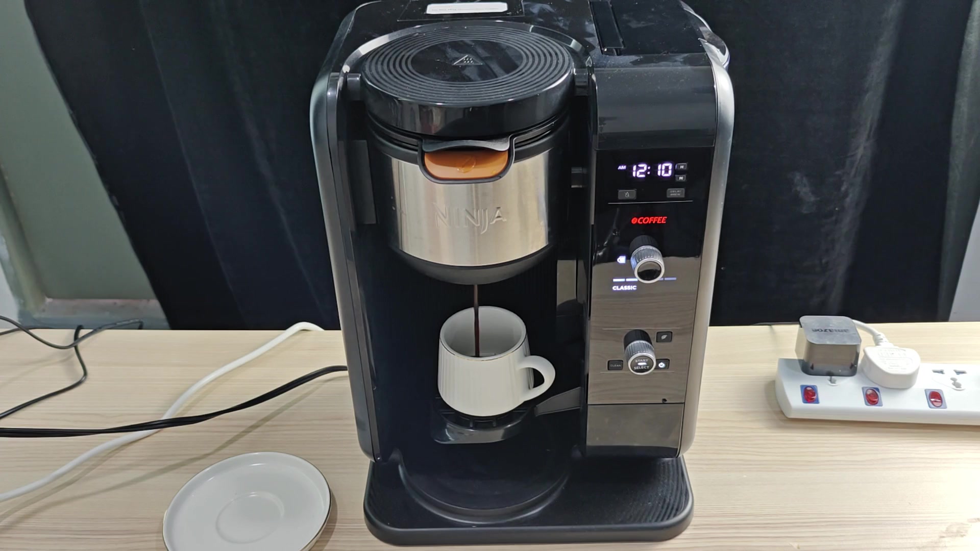 Freshly brewed coffee pouring into white mug Freshly brewed coffee pouring into white mug