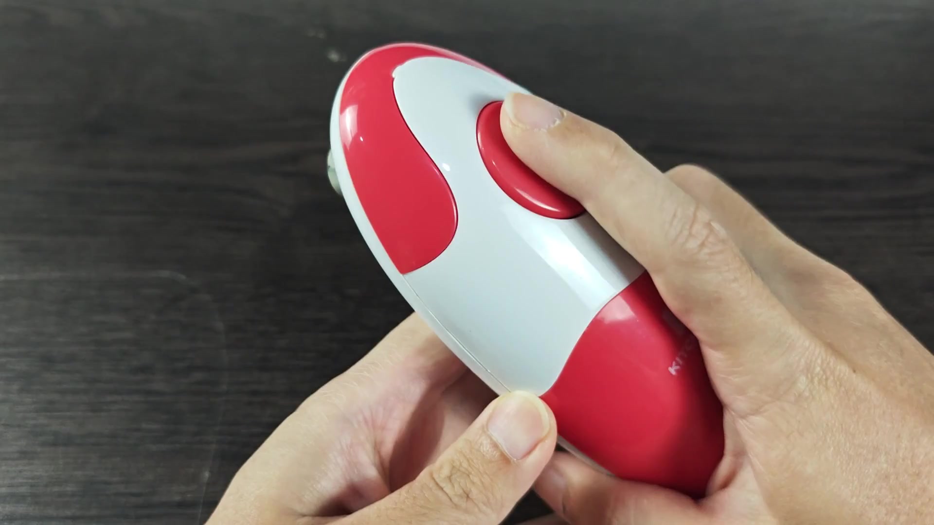 Front view of handheld electric can opener Front view of handheld electric can opener