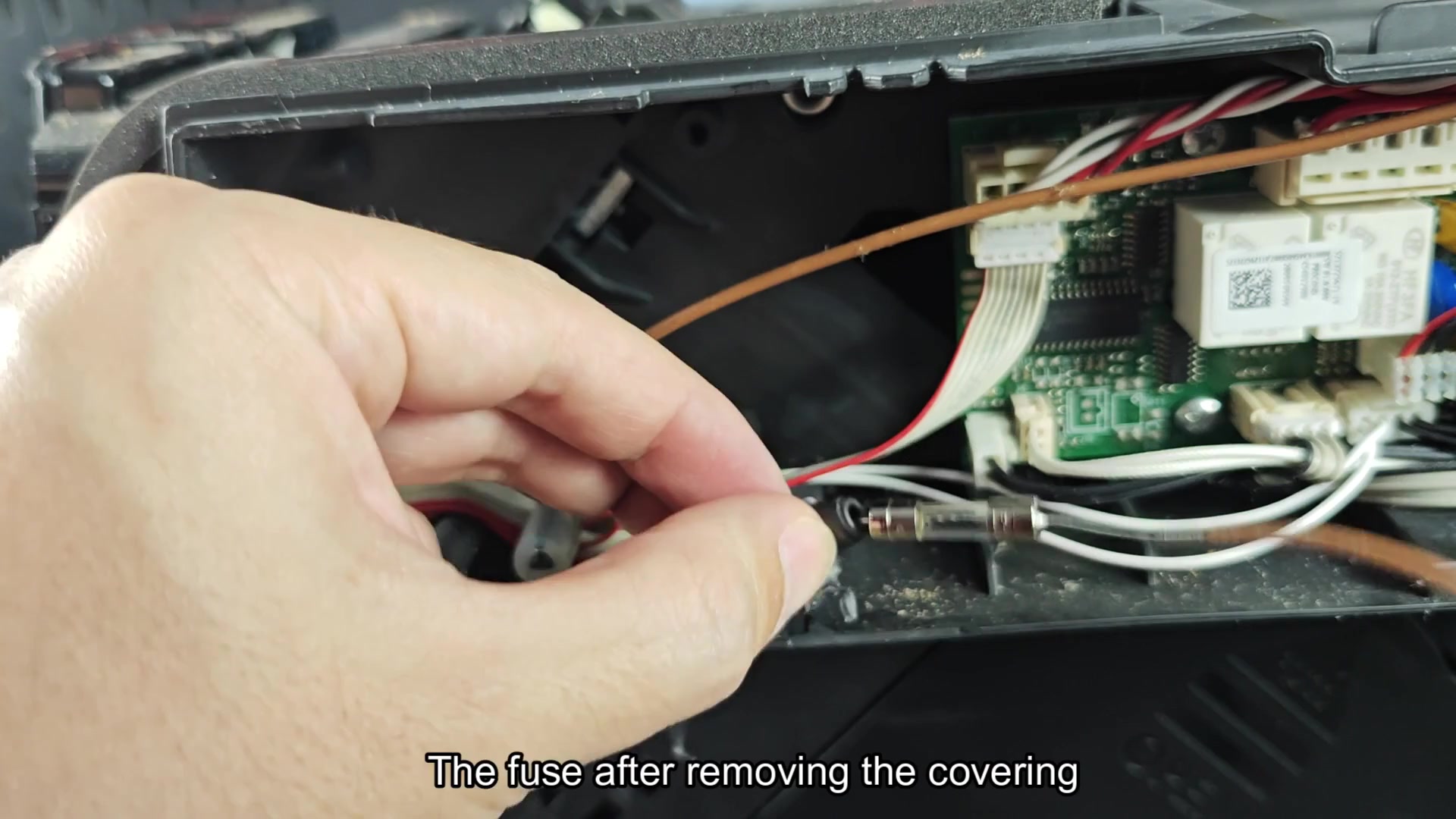 Glass tube fuse revealed after uncovering Glass tube fuse revealed after uncovering