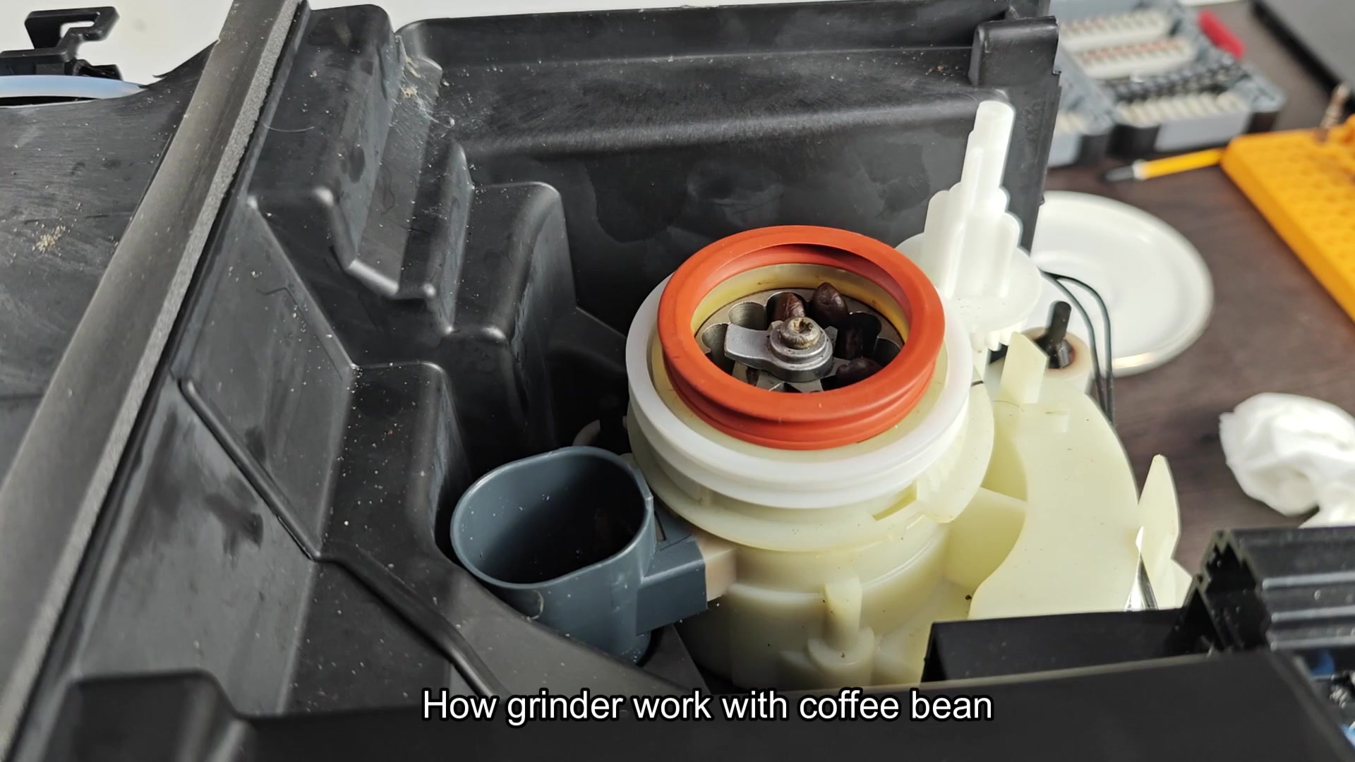 Grinder mechanism spinning with beans Grinder mechanism spinning with beans
