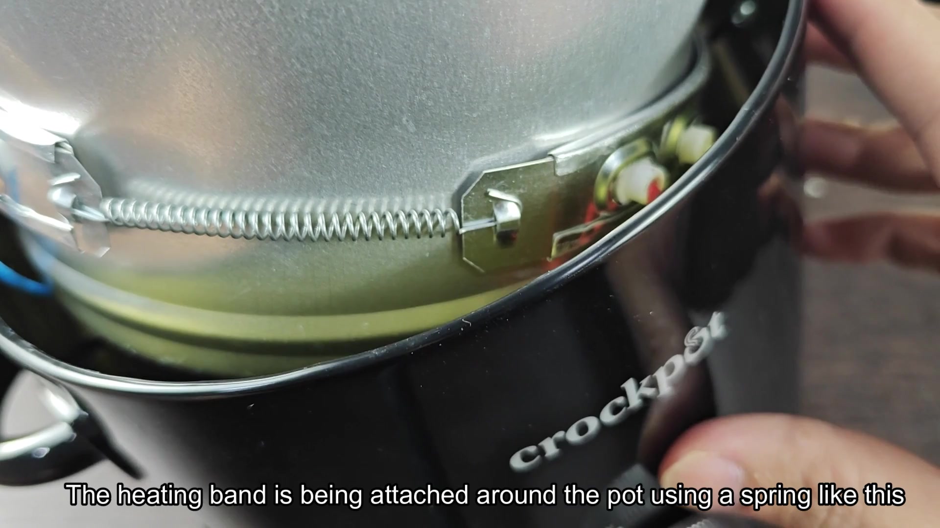 Heating band secured around inner pot Heating band secured around inner pot