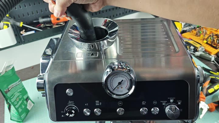Inserting hose into steam wand port Inserting hose into steam wand port