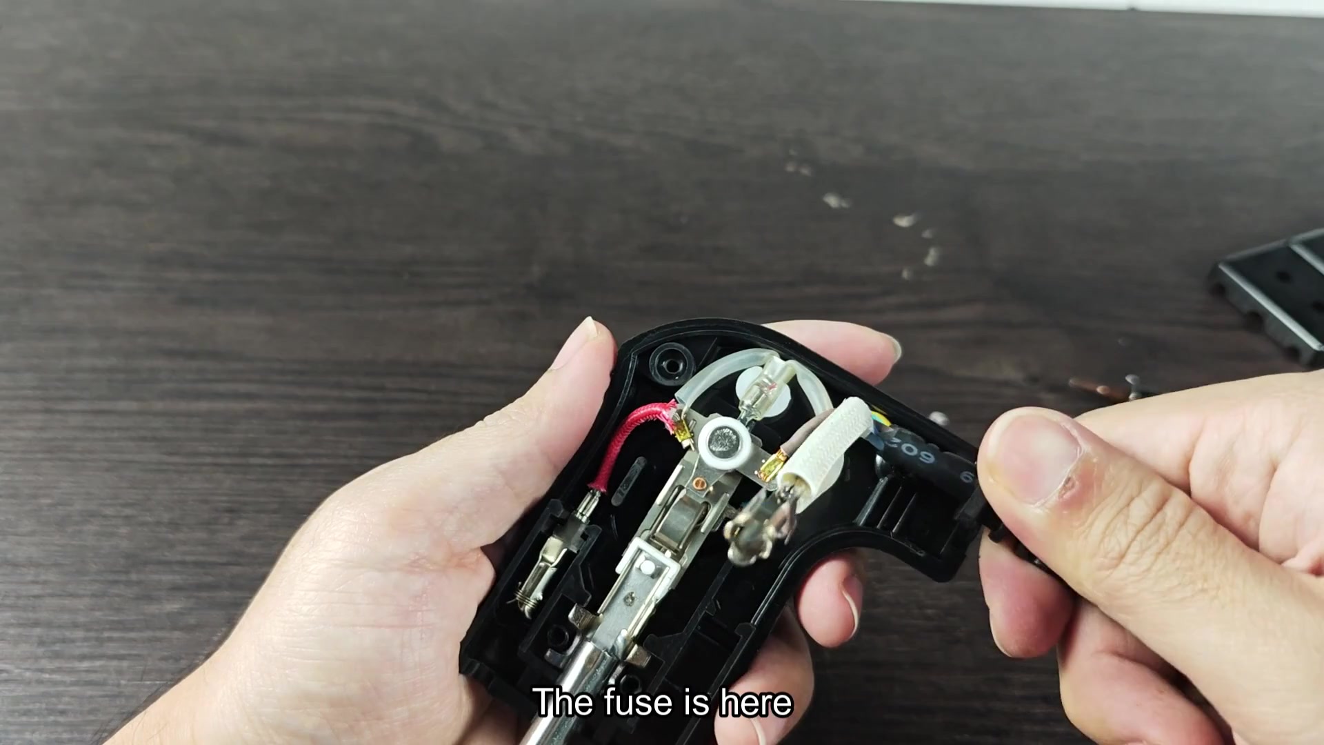Locate the fuse among internal wires Locate the fuse among internal wires