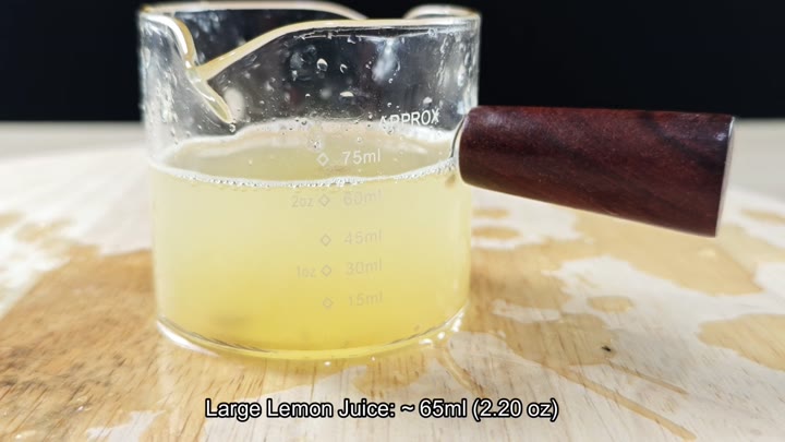 Measuring cup showing large lemon juice volume Measuring cup showing large lemon juice volume