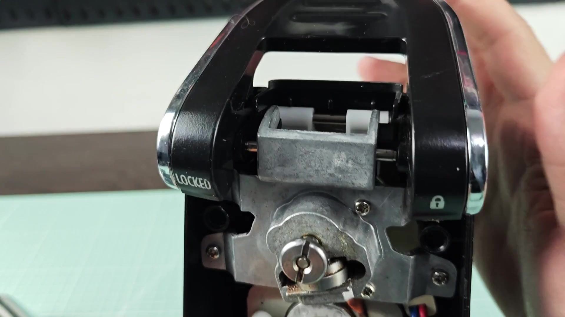 Metal housing with lock cylinder and slider Metal housing with lock cylinder and slider
