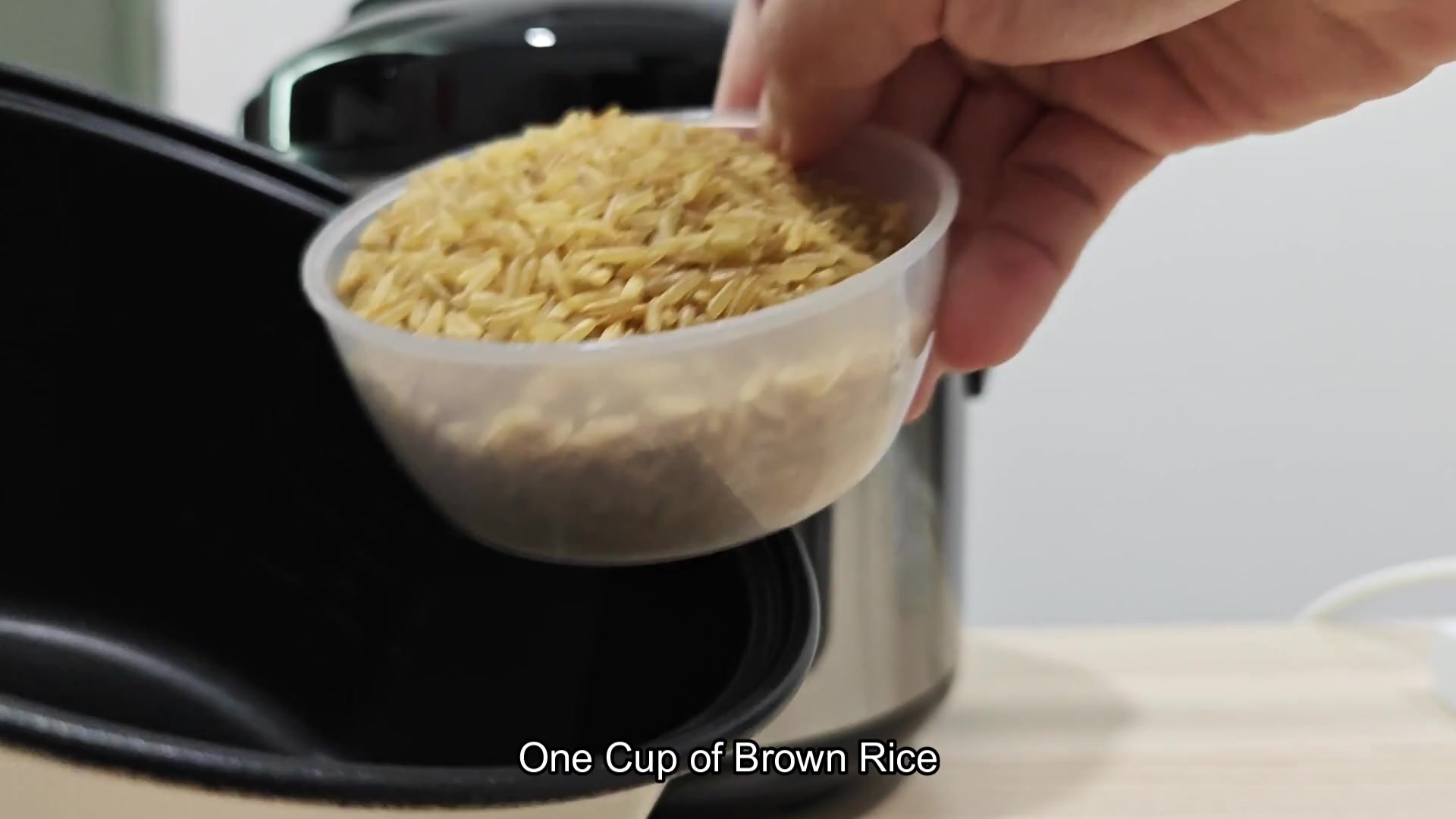 One cup of brown rice added to pot One cup of brown rice added to pot