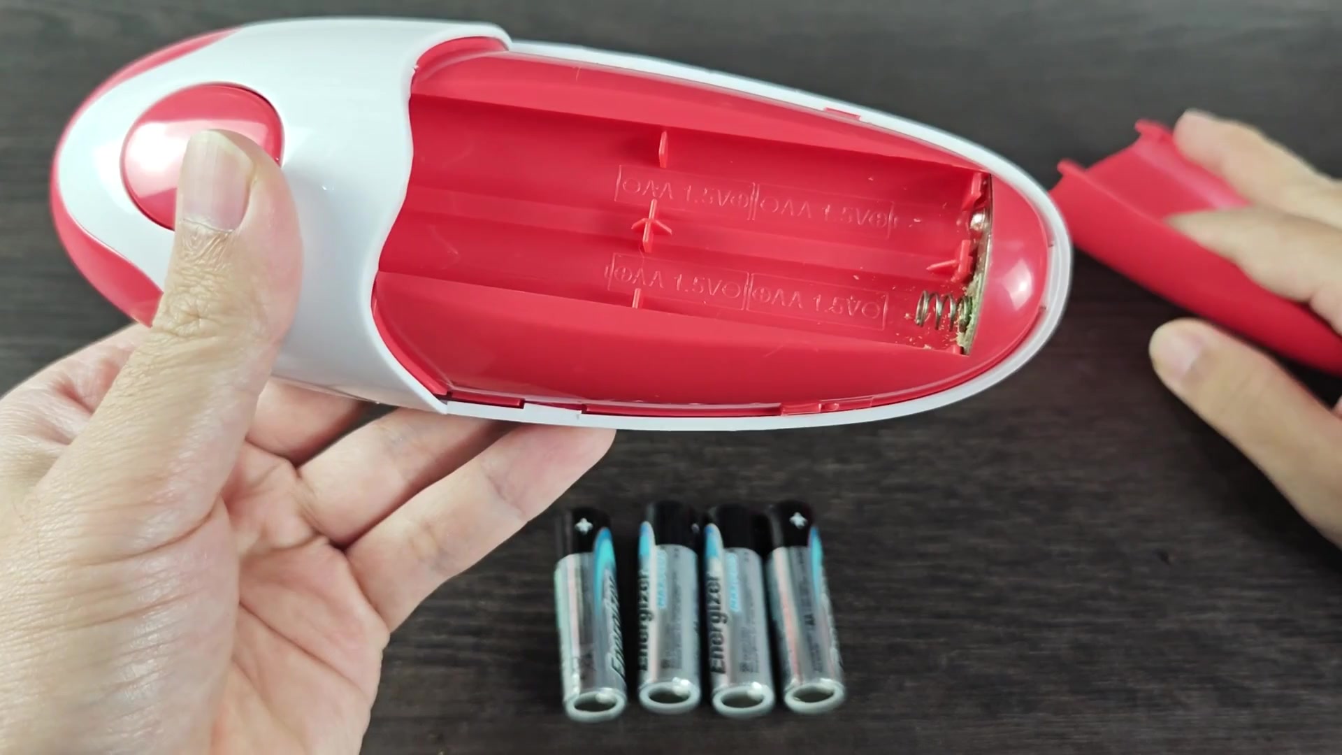 Open battery compartment with spring contact Open battery compartment with spring contact