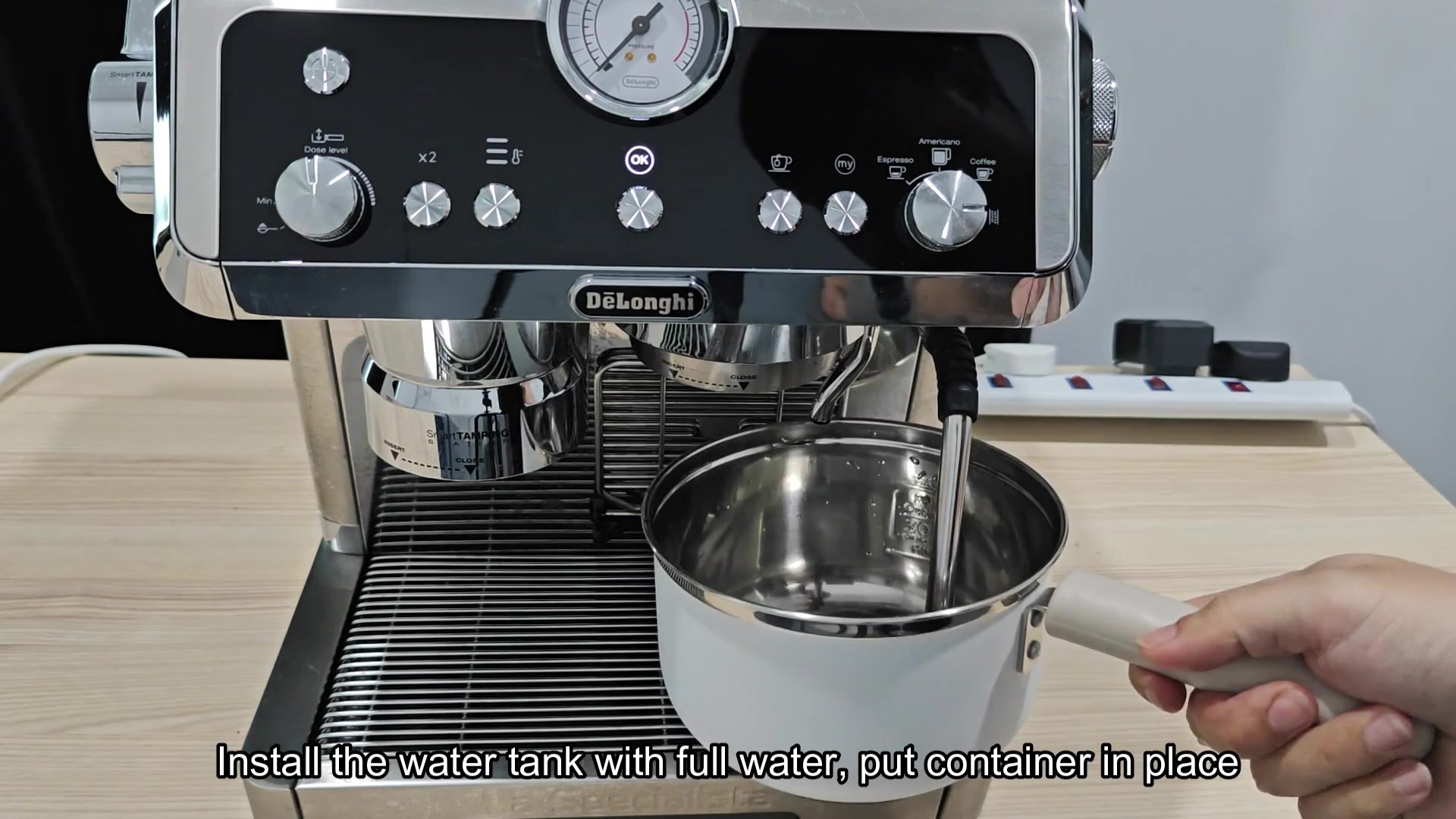 Place container under steam wand outlet Place container under steam wand outlet