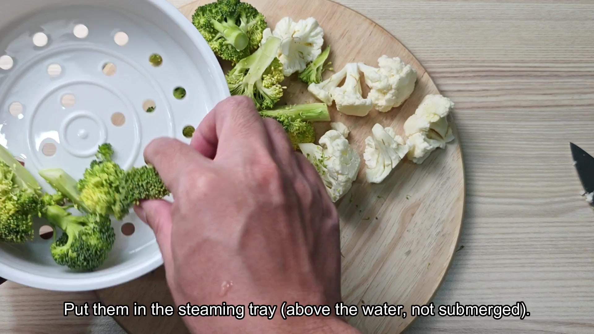 Place vegetables in steaming tray above water Place vegetables in steaming tray above water