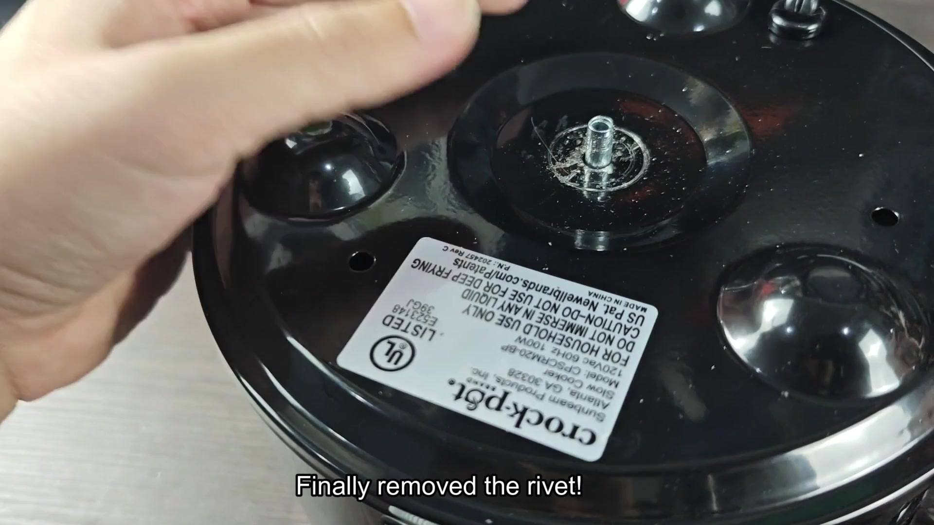 Removed metal rivet above Crock-Pot label Removed metal rivet above Crock-Pot label