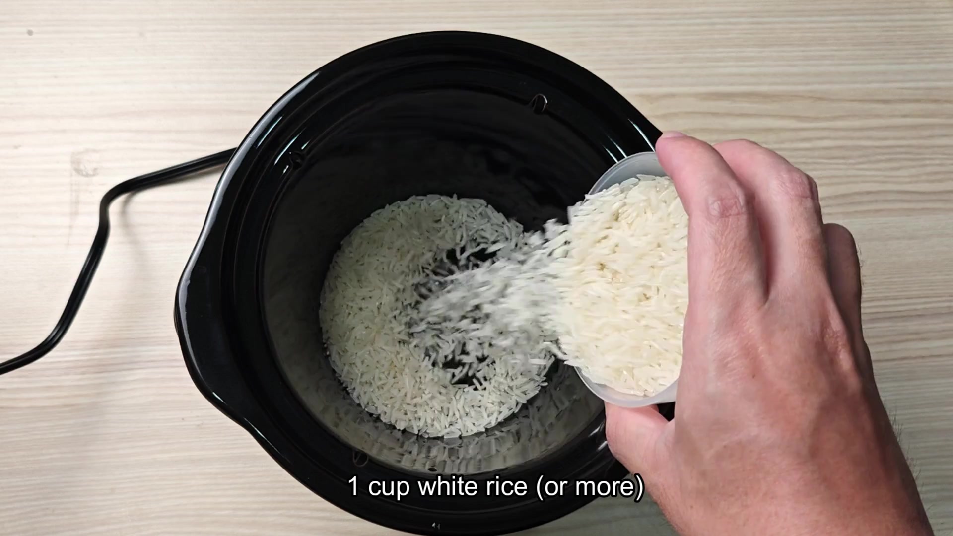 Rinsing rice under cold water in sink Rinsing rice under cold water in sink