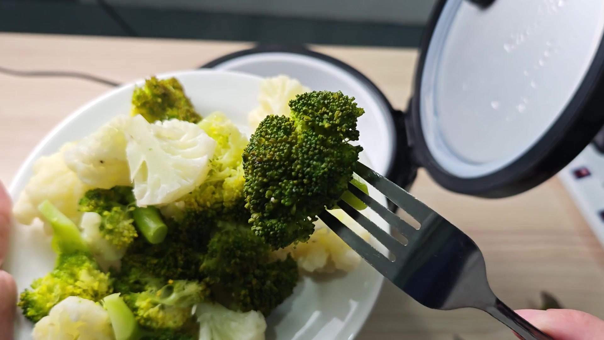 Scoop tender steamed broccoli onto plate Scoop tender steamed broccoli onto plate
