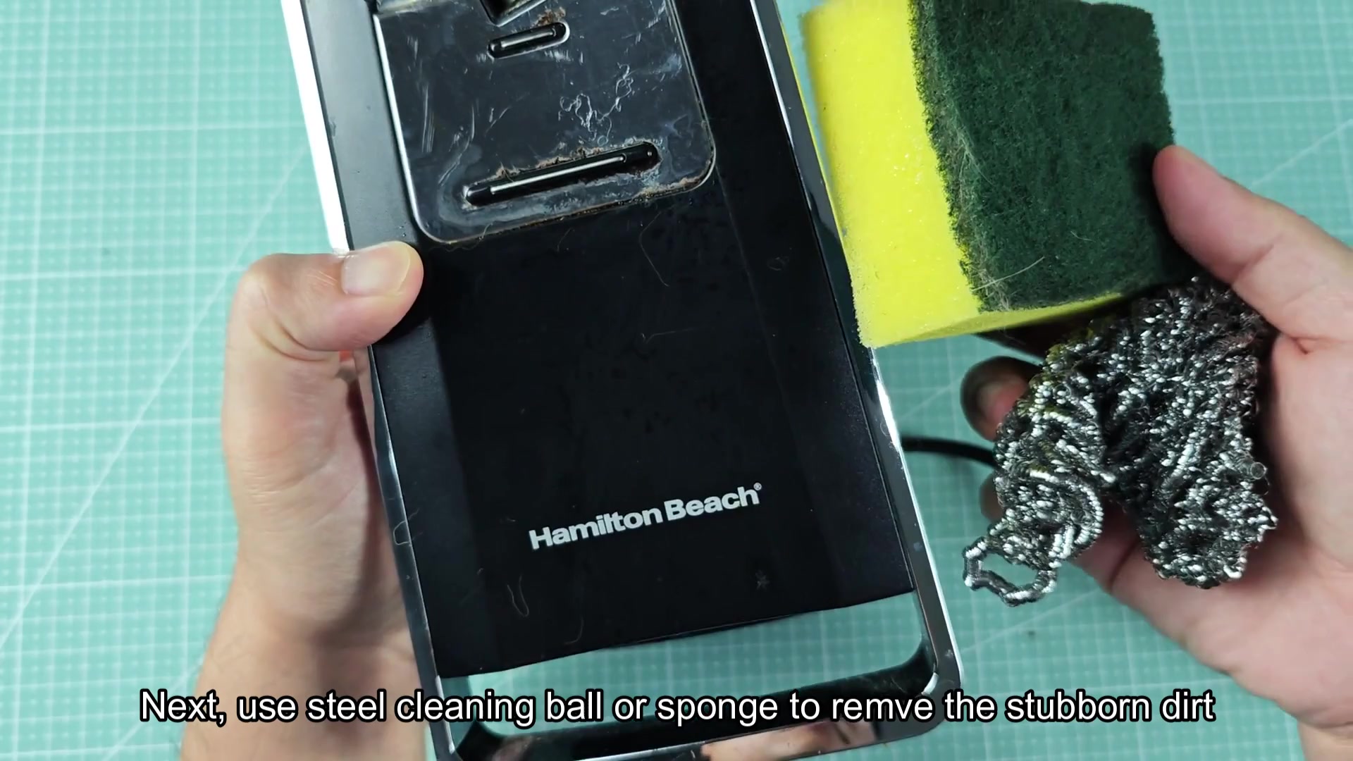 Scrubbing metal panel with steel wool Scrubbing metal panel with steel wool