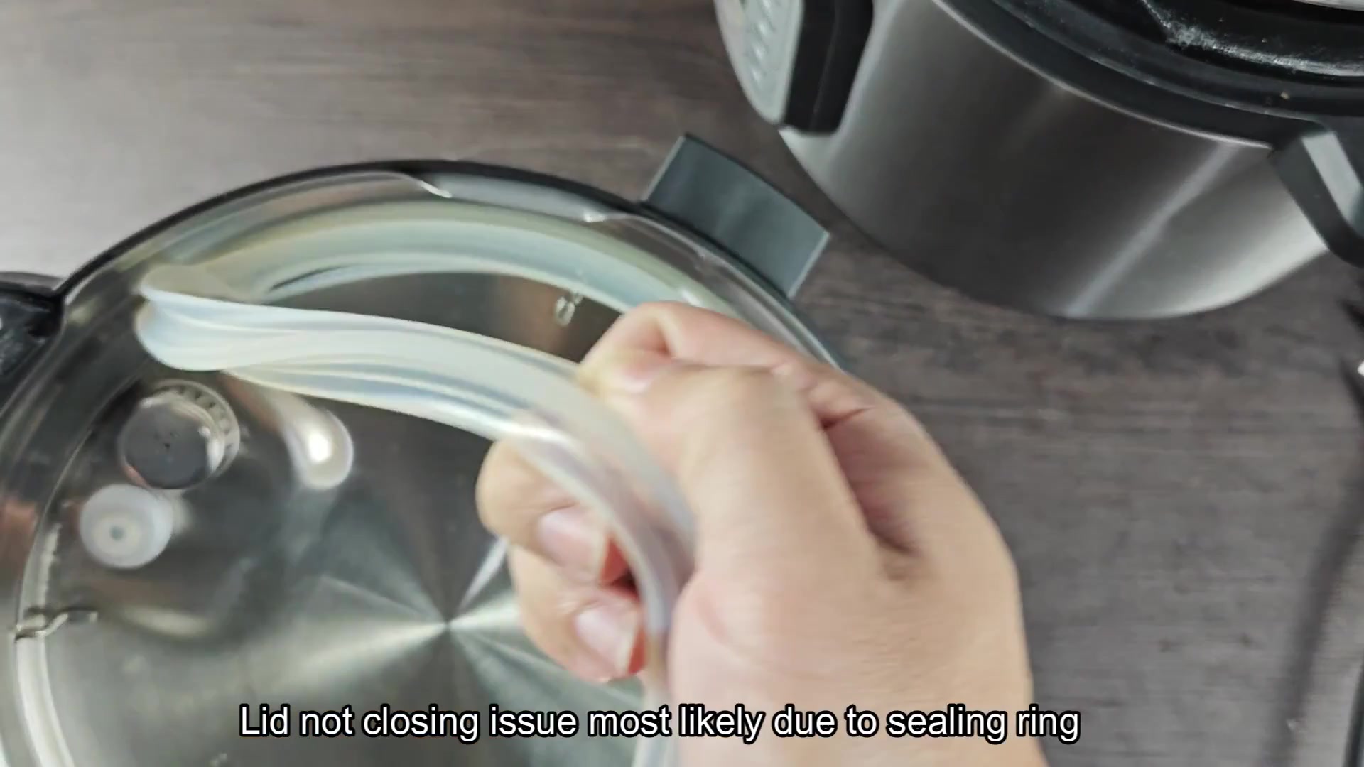 Sealing ring removed from pressure cooker lid Sealing ring removed from pressure cooker lid