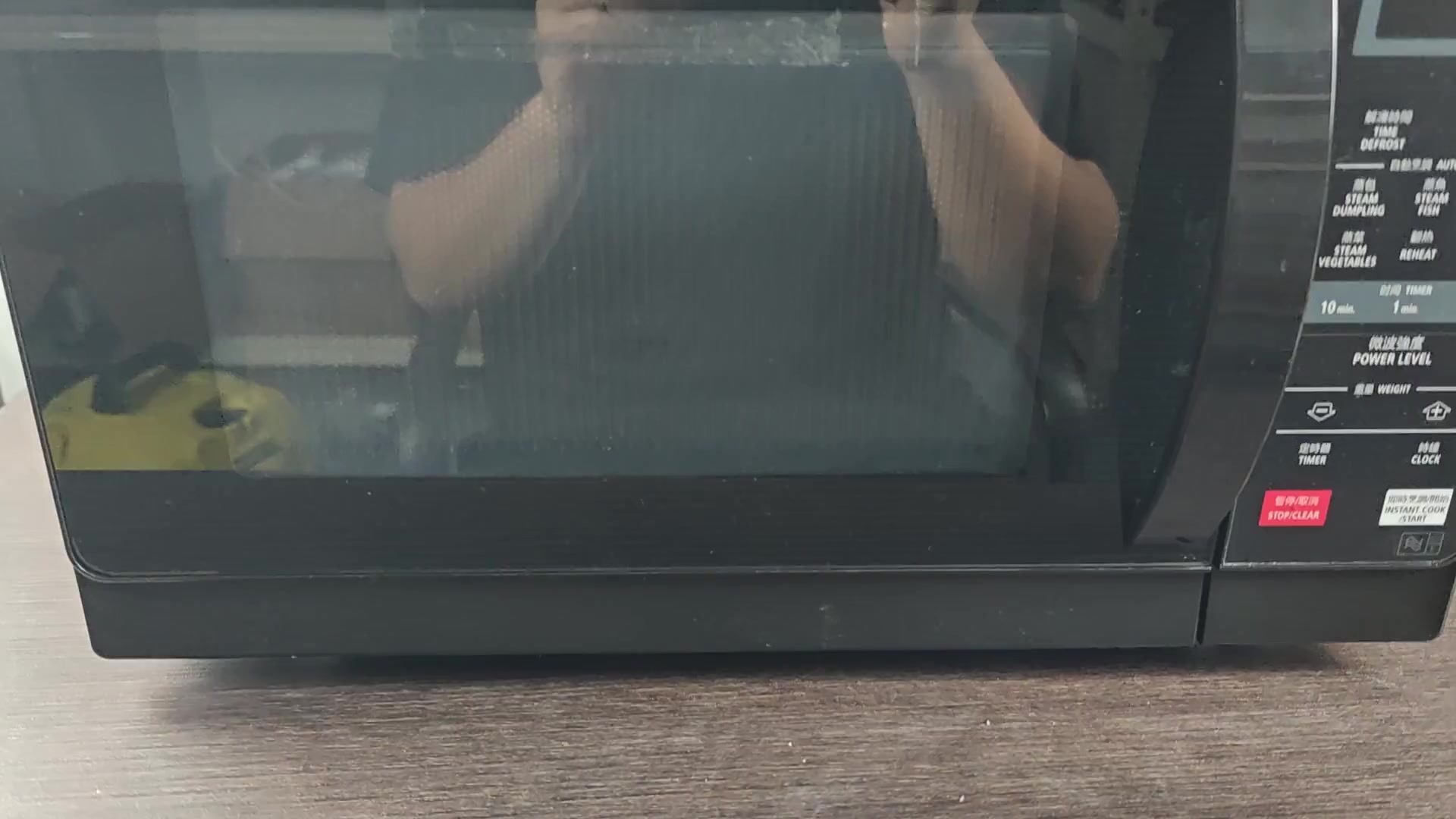 Sharp microwave closed on table Sharp microwave closed on table