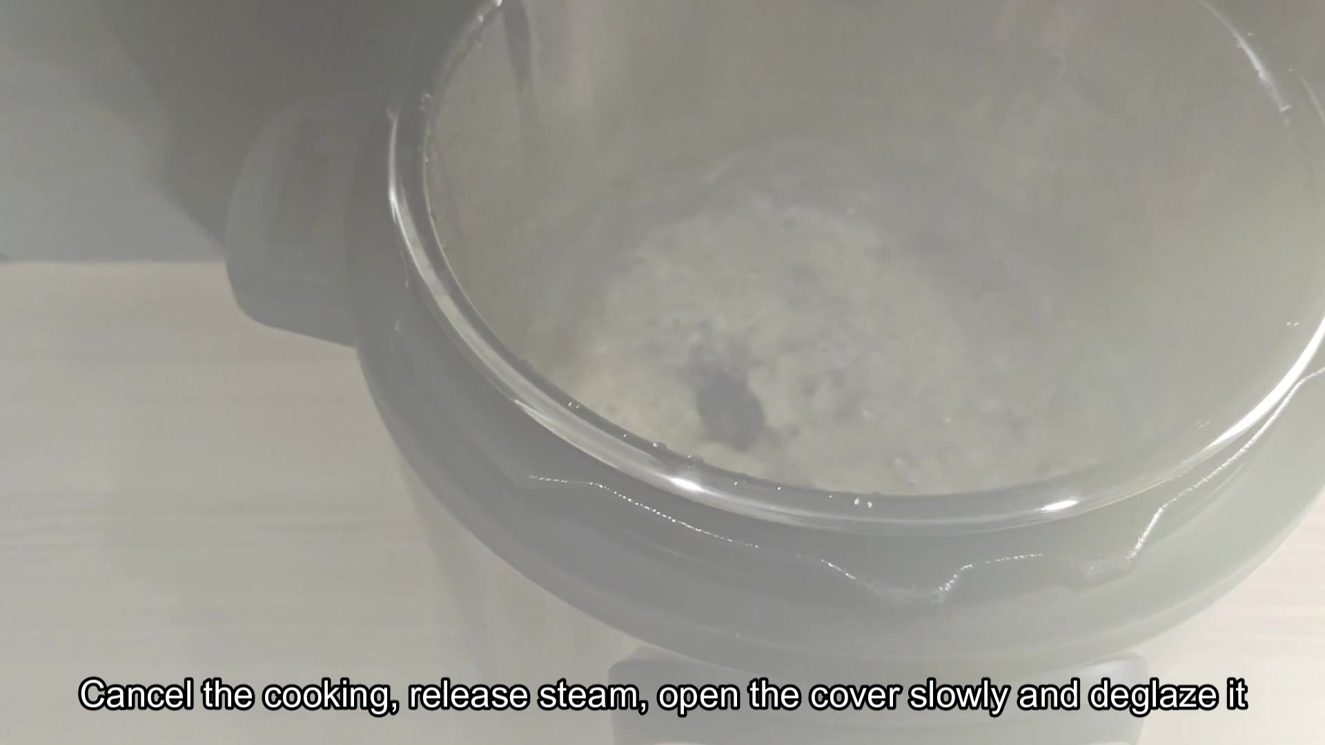 Steam rising from foamy liquid in pot Steam rising from foamy liquid in pot