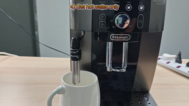 Steam wand inserted into white mug Steam wand inserted into white mug