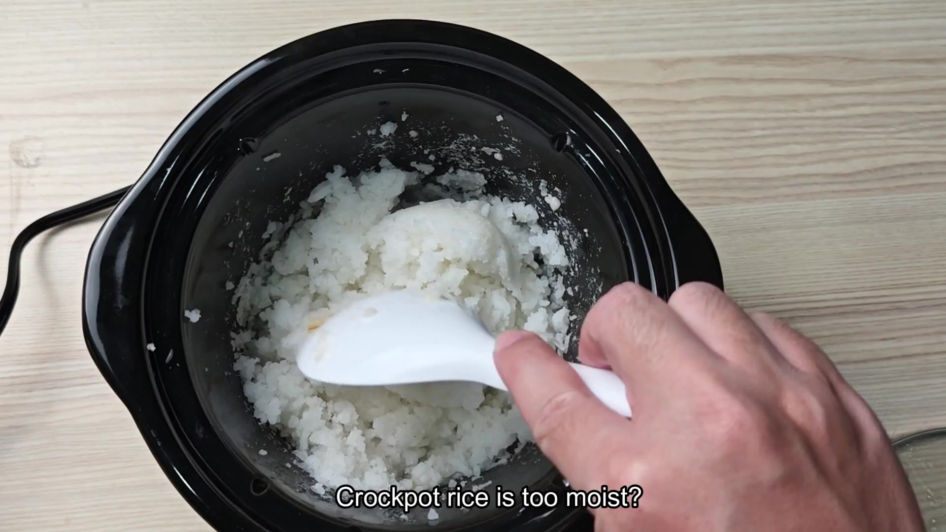 Stirring moist rice in slow cooker Stirring moist rice in slow cooker