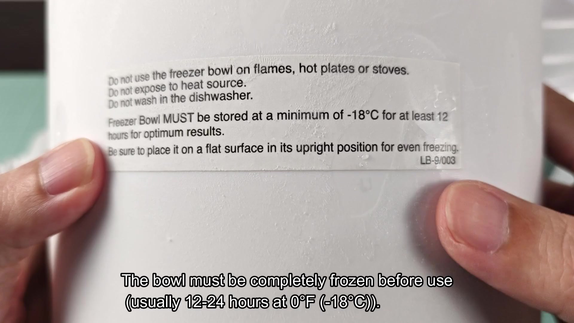 Touching frozen bowl to check hardness Touching frozen bowl to check hardness