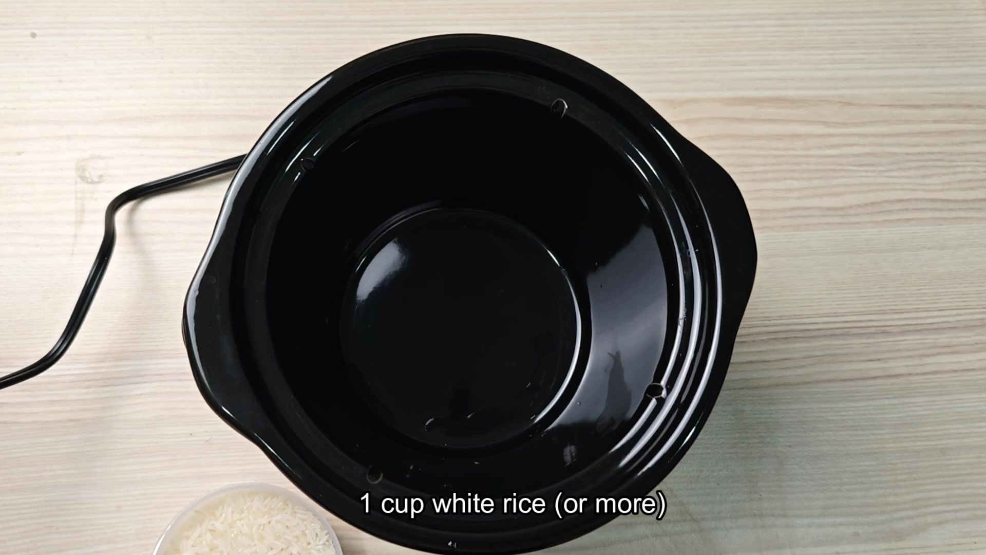Uncooked white rice in slow cooker pot Uncooked white rice in slow cooker pot