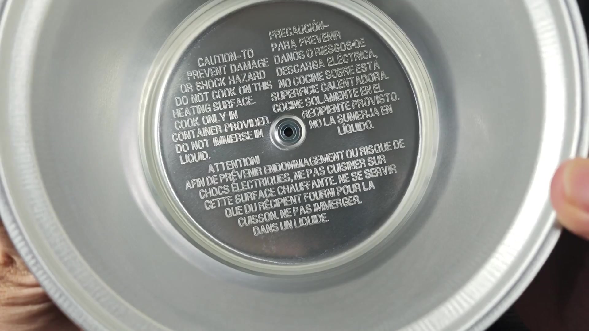 Underside showing caution label and rivet Underside showing caution label and rivet