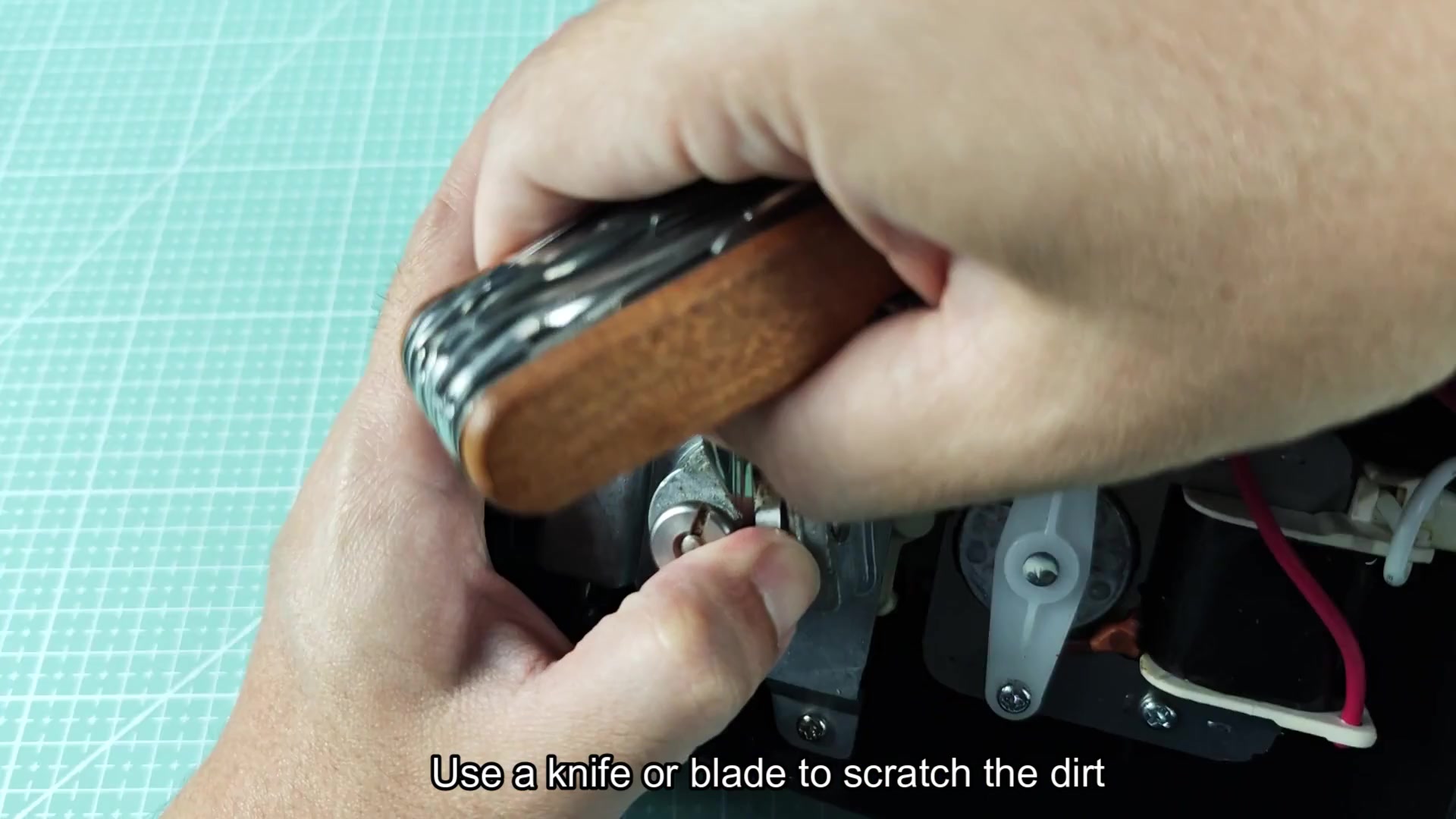 Using multi-tool to scrape small metal parts Using multi-tool to scrape small metal parts