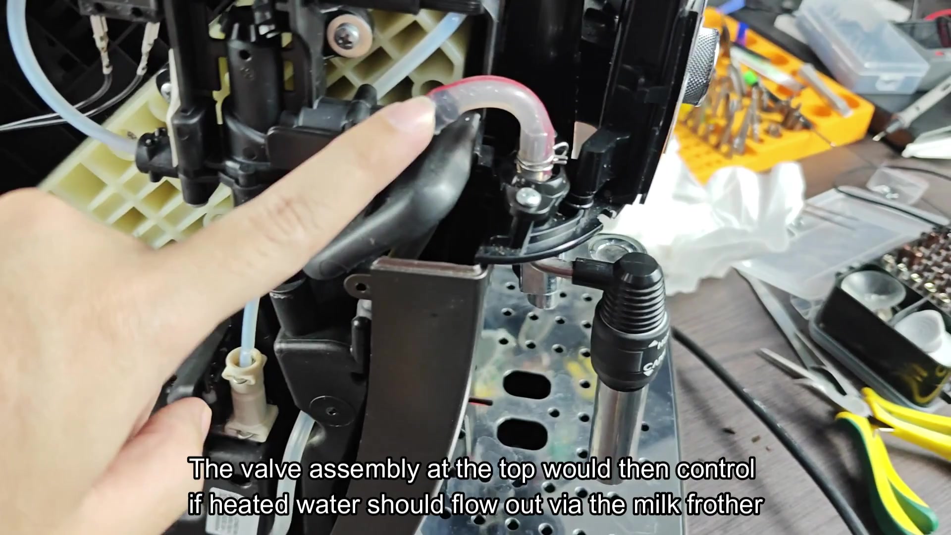 Valve controls frother water flow path Valve controls frother water flow path