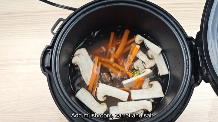 Adding mushrooms carrots and salt Adding mushrooms carrots and salt