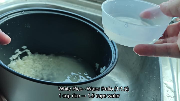 Adding water to rice for cooking Adding water to rice for cooking