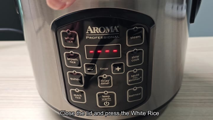 Aroma cooker white rice button selected Aroma cooker white rice button selected