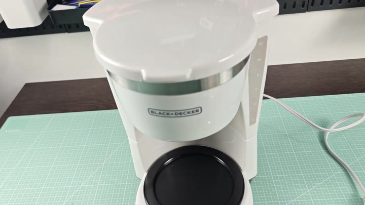Black Decker coffee maker on green mat Black Decker coffee maker on green mat