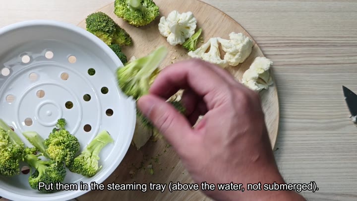 Broccoli florets placed in steaming tray Broccoli florets placed in steaming tray