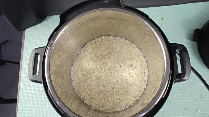 Cooked sushi rice in stainless steel inner pot Cooked sushi rice in stainless steel inner pot