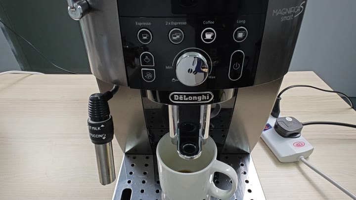 Dispensing coffee into a white mug Dispensing coffee into a white mug