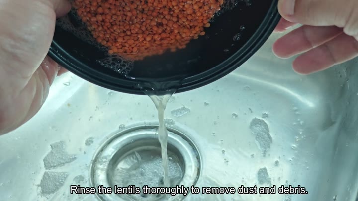 Draining cloudy water from lentils Draining cloudy water from lentils