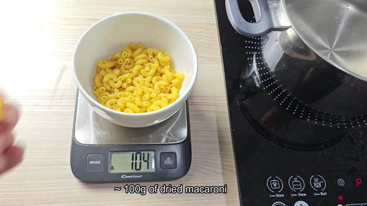 Dried macaroni weighed on digital scale Dried macaroni weighed on digital scale