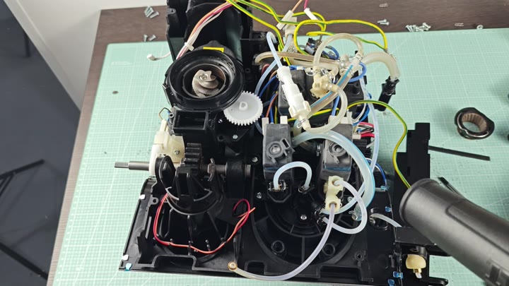 Exposed motors, gears, and wires on mat Exposed motors, gears, and wires on mat